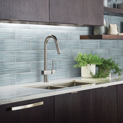 kitchen with white countertops and dark wood shelves